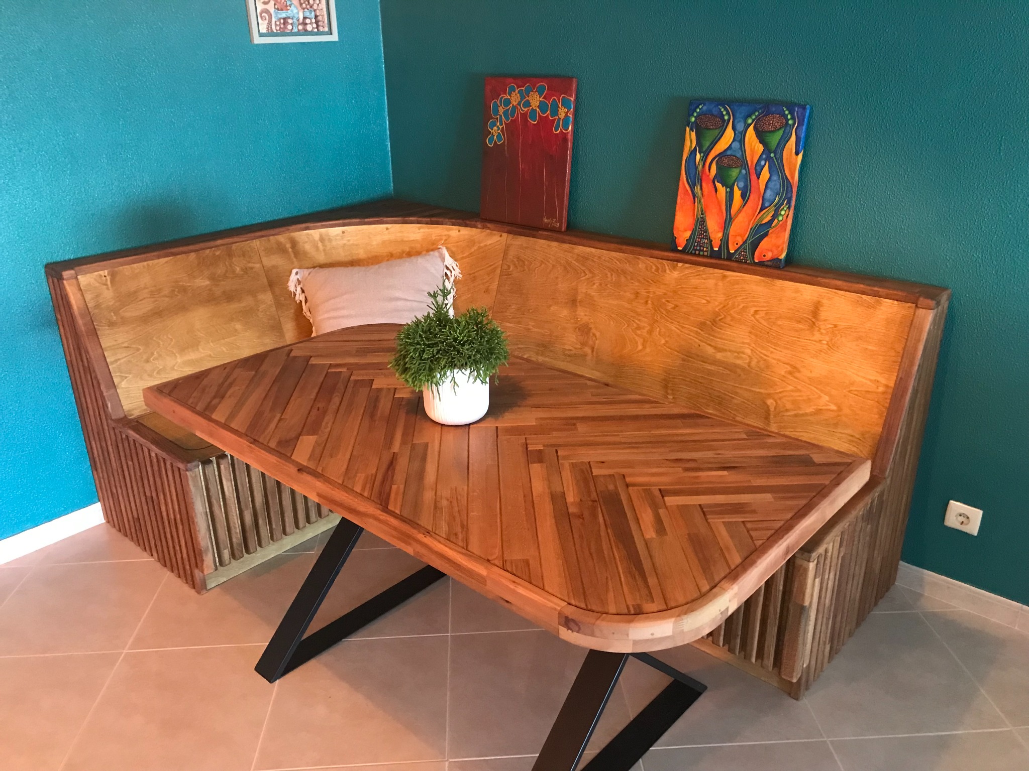 Completed handmade corner dining nook with a herringbone table
