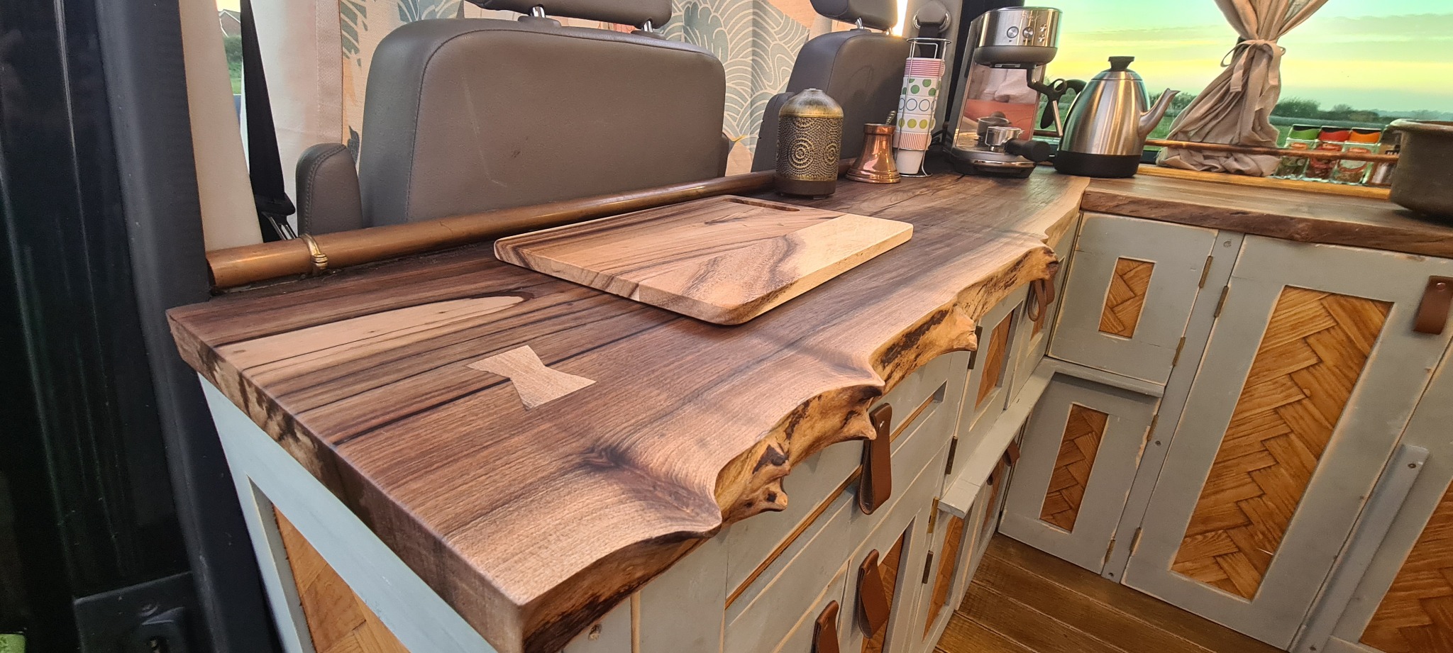 Close view of a live-edge walnut campervan worktop with a butterfly key